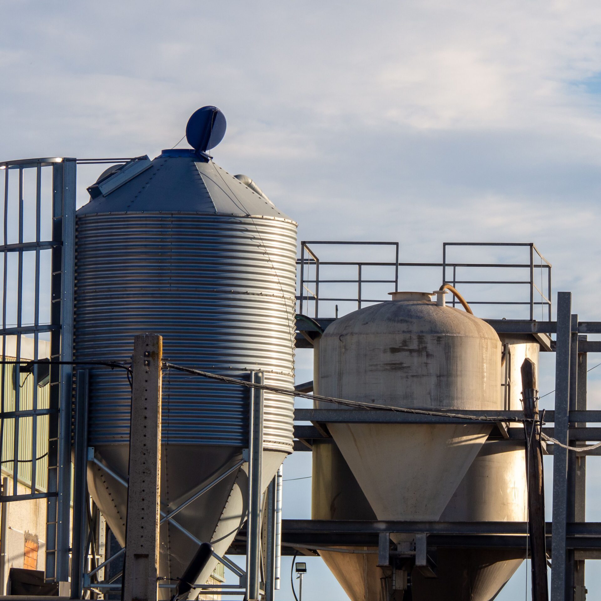 An Industrial silo located on an organic farm, concept of sustainability